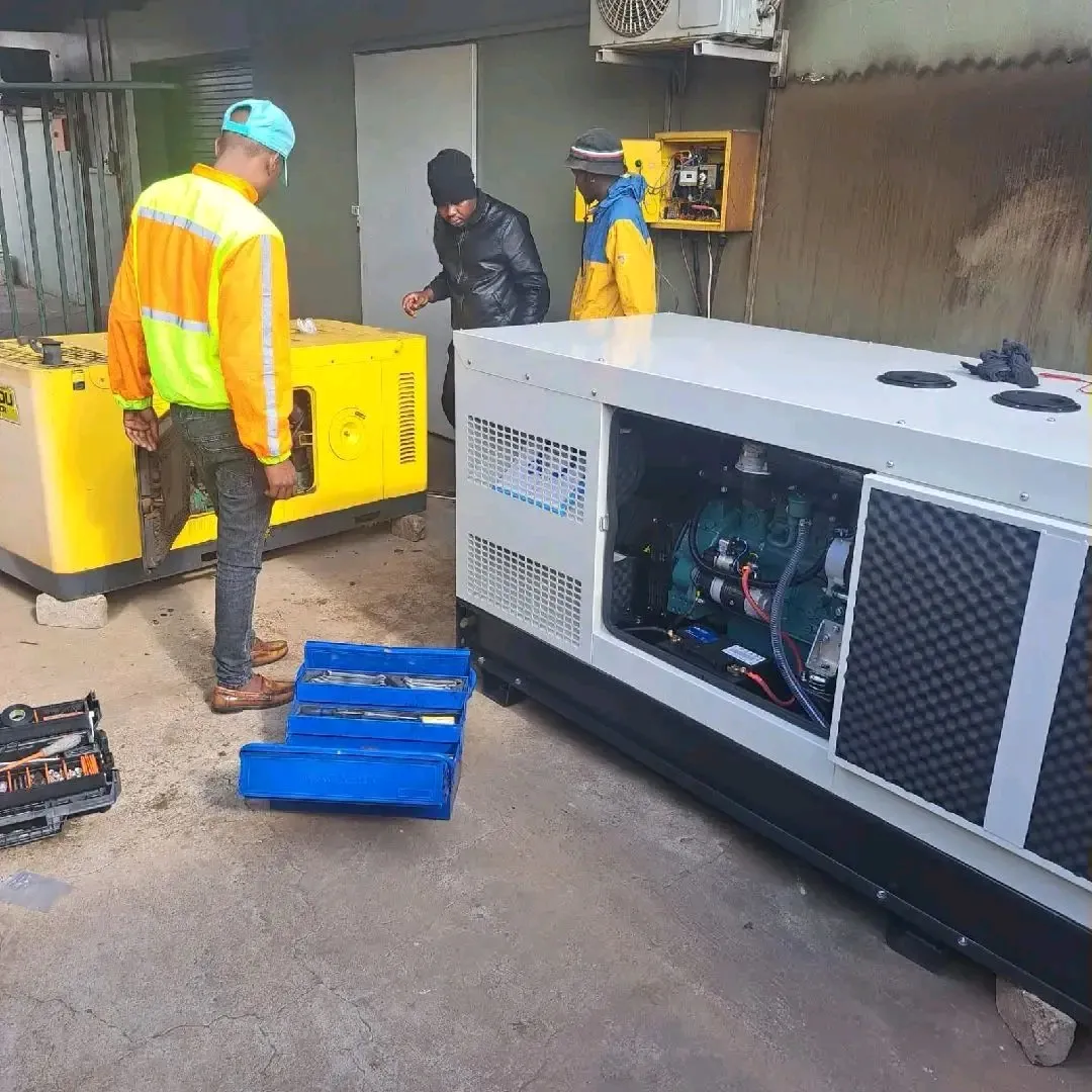 Technicians repairing diesel generators on site